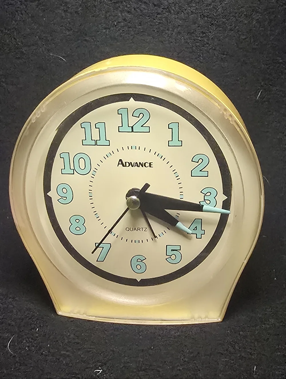 Advance Yellow Clock with Aqua Numerals